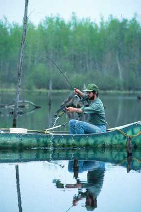 Canoeist landing crappie